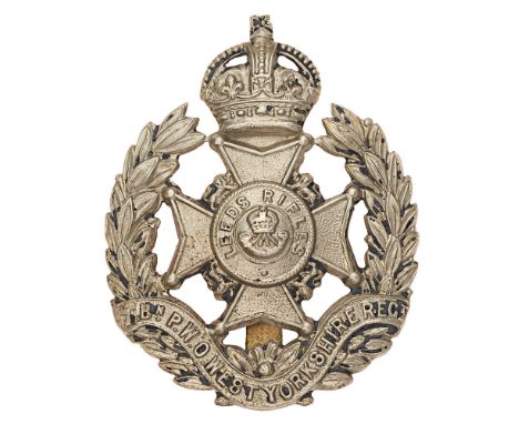 7th Bn. PWO West Yorkshire Regiment (Leeds Rifles) post 1908 cap badge.  Good scarce die-stamped white metal crowned Maltese 