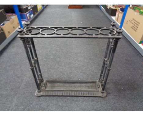 A 19th century cast iron Coalbrookdale stick stand with lift out tray, lozenge registration marked stamped to underside , bas