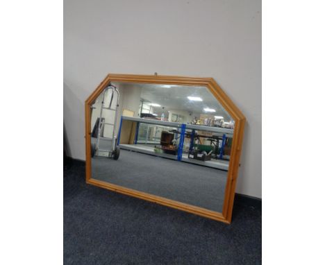 A large pine framed overmantel mirror together with a pine framed nursery print and one other mirror. 