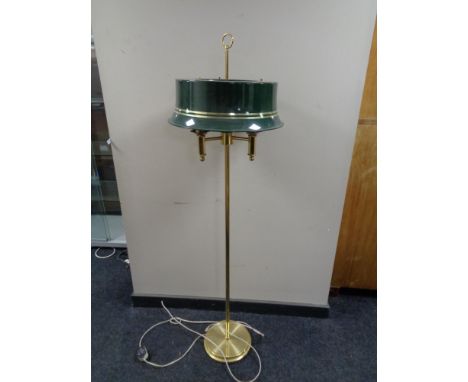 A brass three way floor lamp with metal shade (continental wiring).  CONDITION REPORT: Currently no plug so will require a re