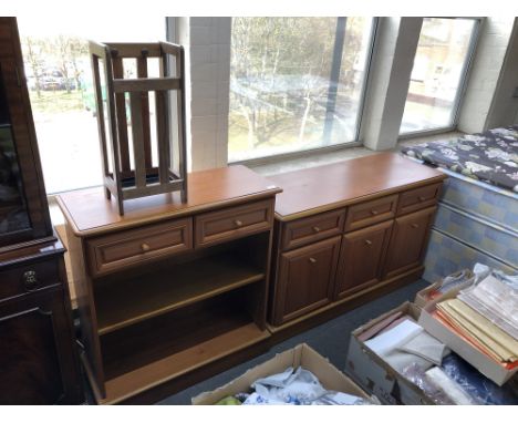 A contemporary teak three door sideboard together with matching shelves and stick stand 