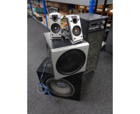 A Logitech sub speaker with further pair of speakers, a sub woofer amplifier, together with an Ibiza sound port PA.  