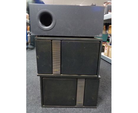 A pair of Bose speakers together with a Jamo SW140 speaker.  