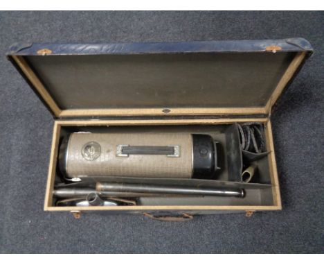 A cased 20th century vintage Danish cylinder hoover with accessories.  