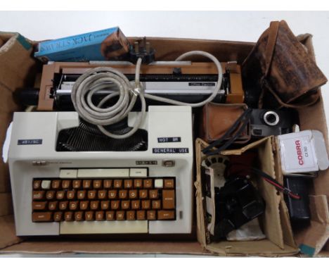 A box containing Smith Corona typewriter, assorted cameras, View master with reels.  