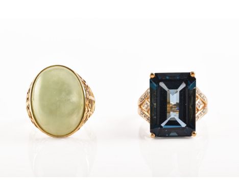 A 14ct yellow gold Chinese cabochon jadeite ring, size N, together with a 9ct yellow gold blue stone cocktail ring with diamo