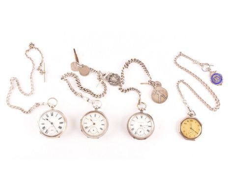 A group of four antique silver pocket watches with white enamel dials and black Roman numerals, one with octagonal case, all 