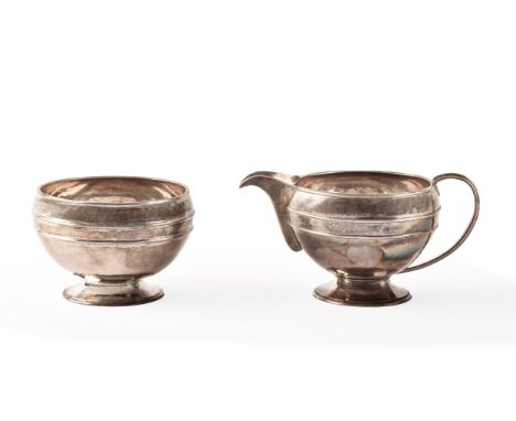 A George V silver creamer and sugar bowl, both hallmarked for London 1929 by 'COFH'. (2)  Condition Report: 12.0 ozt / 374.1 