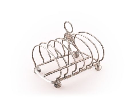 A Victorian silver toast rack, crest engraved, hallmarked for London 1858 by&nbsp;Charles Thomas Fox &amp; George Fox, length