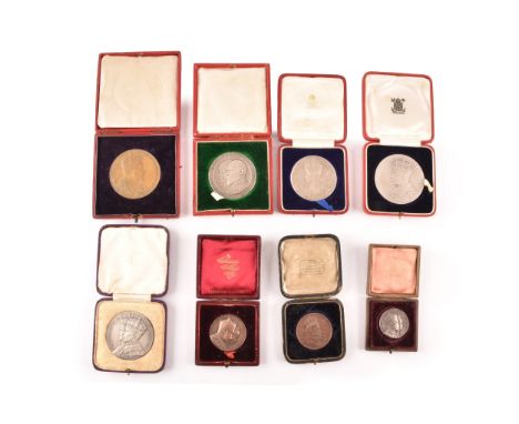 A collection of Commemorative Coronation silver and bronze medals, including George VI and Queen Elizabeth, George V and Quee