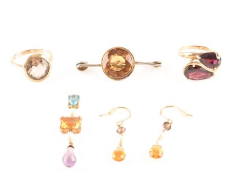 a group of mixed gemstone jewellery, including a 9ct yellow gold crossover ring set with two pear shape maroon stones, size M