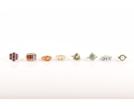 A group of rings, including five 9ct yellow gold rings set with various gemstones, along with two silver and one white metal 