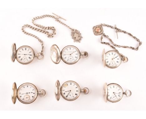 A collection of six antique silver half hunter pocket watches, all with white enamel dials and black Roman numerals, two with