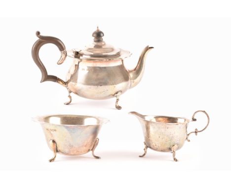 A matched silver tea set, comprising a George V silver teapot, with ebonised handle, full hallmarks for London 1919 by&nbsp;R