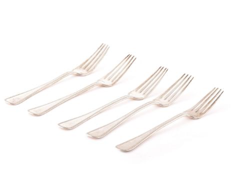 Five Danish silver dinner forks, with beaded edging and crest engraved, hallmarked for Copenhagen 1905 and 1904 by Vilhelm&nb