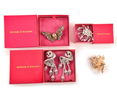 A large collection of Butler &amp; Wilson jewellery, including a winged skull brooch, a pair of ornate skull brooches, a sing