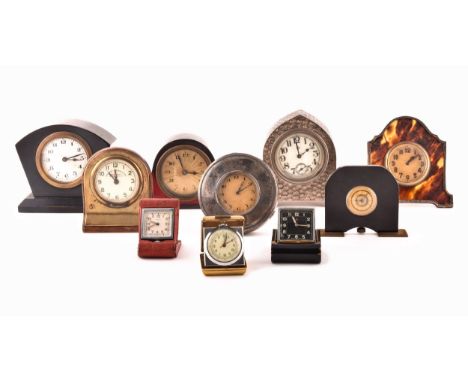 A collection of miniature novelty travel and desk clocks, folding travel clocks including a silver mounted example, a tortois