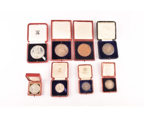 A collection of Commemorative Coronation silver and bronze medals, including Edward VII Crowned 1902 and Alexandria Queen Con