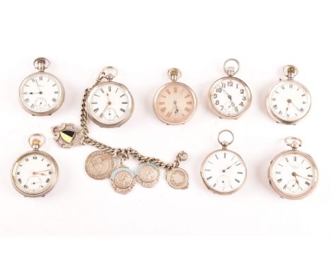 A collection of eight antique silver pocket watches, all with white enamel dials and black Roman or Arabic numerals, one with