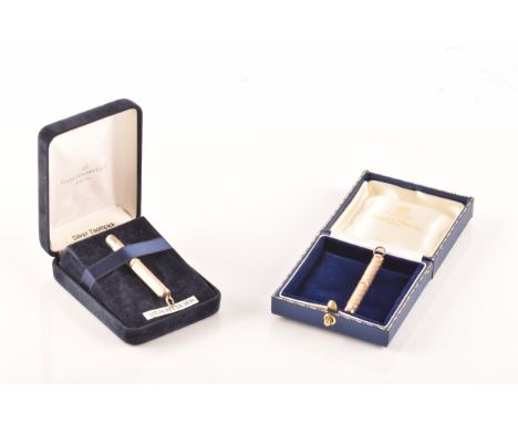 A Mappin &amp; Webb 9ct yellow gold toothpick in box, together with a Goldsmiths silver toothpick in box. (2)  Condition Repo