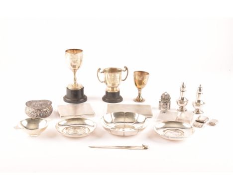 A group of assorted silver items of various dates and maker's, including three trophy cups hallmarked for London and Birmingh