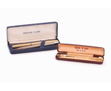 A sterling silver cased ballpoint pen, hallmarked for 2000, together with a rolled gold yard of lead pencil and a gold finish