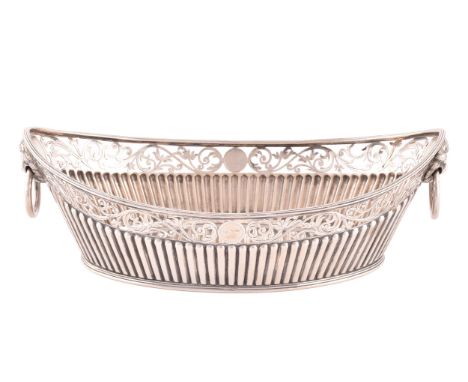 A Victorian silver bon bon dish, hallmarked England 1859 by C.F, boat shaped with half ribbed decoration and lion mask handle