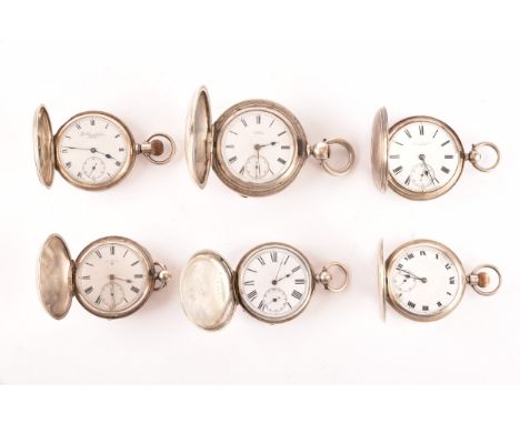 A collection of six antique silver full hunter pocket watches, all with white enamel dials and black Roman numerals, dials si