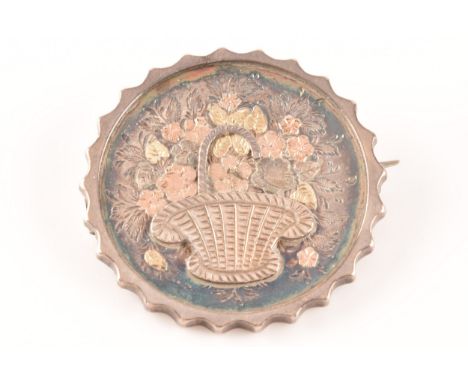 A silver brooch hallmarked for Birmingham 1912, circular shaped with floral basket design, together with a silver rose quartz