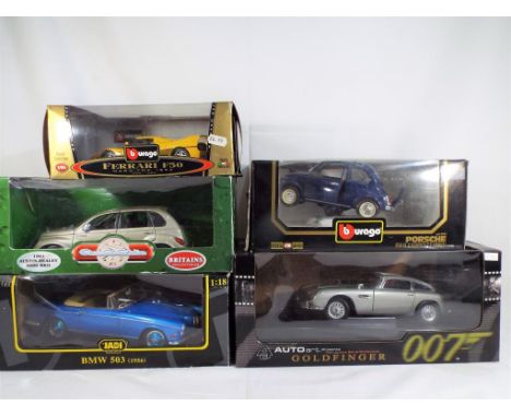 Auto Art, Burago and others - five diecast vehicles in 1:18 and 1:24 scale in associated boxes, comprising an Aston Martin (s