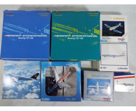 Eight diecast models of commercial airliners by Herpa, Schabak and Dragon Wings, all in 1:500 or 1:600 scale, all models appe