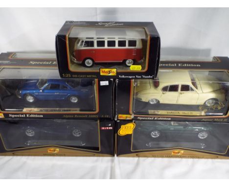 Maisto - five boxed diecast vehicles predominantly 1:18 scale comprising a Jaguar MkII, a Morgan Aero 8, an Aston Martin DB7,