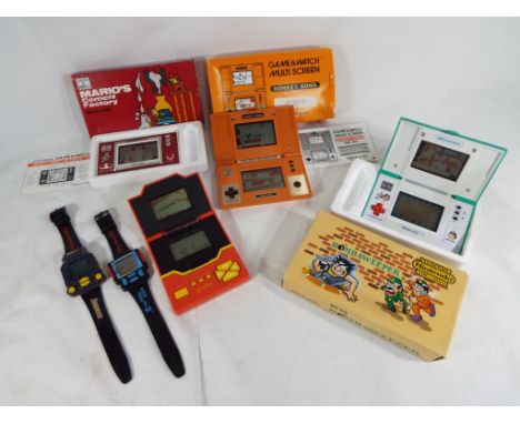 Game and Watch - a Mario's Cement Factory Nintendo digital hand held gaming console by Game and Watch, with original box, ins