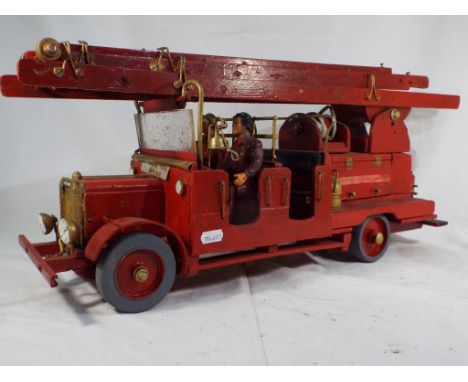 Homemade Leyland Fire Engine with crew, wheels are free moving, made of wood, marked Weymouth Fire Brigade. 26 cm x 58 cm x 1