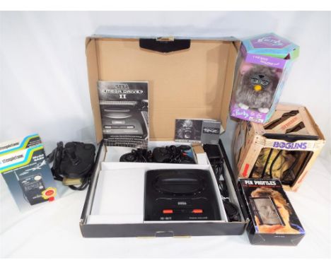 A mixed box to include a Saga Mega Drive video games console with two controllers, instructions and power cables, a further j