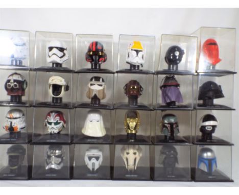 Deagostini - 24 Star Wars helmets in original plastic cases 1:5 scale, includes C3PO, Storm Troopers and others, cases very g