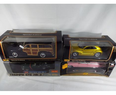 Maisto and some Star - four boxed diecast vehicles 1:18 scale comprising a Chrysler Pronto Cruizer, a 1948 Chevrolet Woody, a