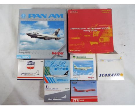 Eight diecast models of commercial airlines by Herpa, Dragon Wings and Schabak, all in 1:500 or 1:600 scale, models appear mi