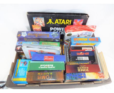 A good mixed lot to include a Competitive Pro Series 5000 Joystick, a Commerce Conflict Bar Code Battler, Atari's power pack,