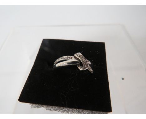 A HALLMARKED 9 CARAT WHITE GOLD DIAMOND RING "(BAND IS SPILT/BROKEN) " approx weight 1.8g 