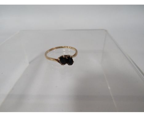 A HALLMARKED 9 CARAT GOLD TWO STONE SAPPHIRE RING approx weight 1.6g