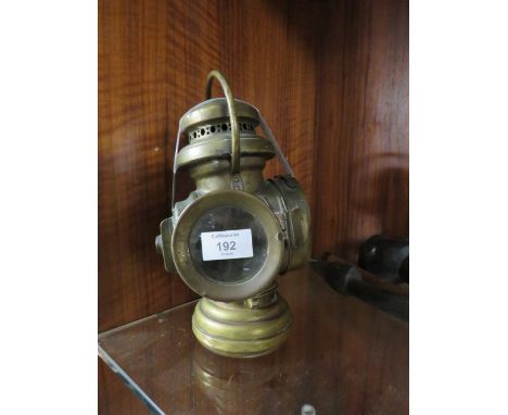 A BRASS RAILWAY LAMP