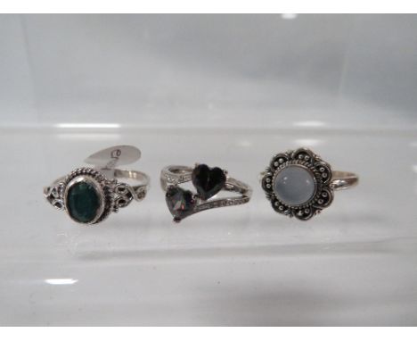 THREE DECORATIVE SILVER DRESS RINGS TO INCLUDE A MYSTIC TOPAZ STYLE EXAMPLE 
