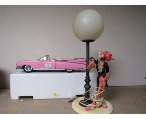 A MAISTO TIN PLATE PINK CADILLAC TOGETHER WITH AN ITALIAN PINK PANTHER TABLE LAMP 