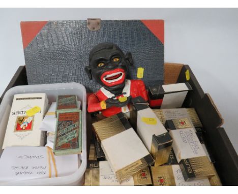 A TRAY TO INCLUDE VINTAGE CIGARETTE CARDS, MONEY BOX* AND EPHEMERA/ ART BOX*These items are listed on the basis they are illu