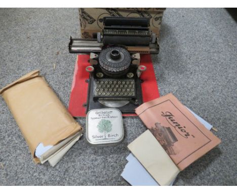 A JUNIOR D.R. PATENTE CHILD'S TYPEWRITER IN ORIGINAL BOX WITH INSTRUCTIONS, RIBBON AND REEL ETC 