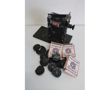 Pathescope 9.5MM film projector and a large selection of various assorted Pathescope baby film reels and two boxed reels 