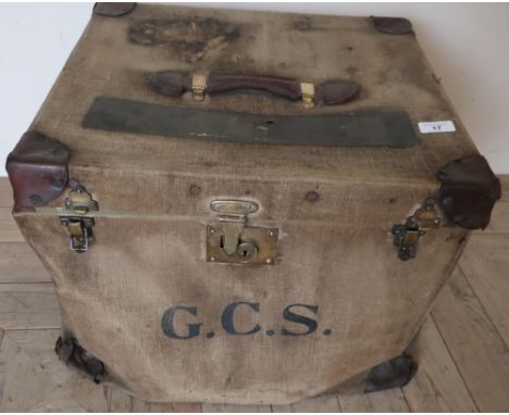 Vintage canvas travelling trunk with leather reinforced corners and handle, and brass locks 