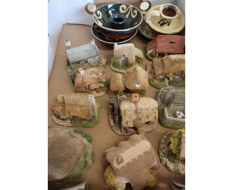 Group of twelve Lilliput Lane cottages, two Beamish studio ceramic candle holders and two Wetheriggs candlesticks 