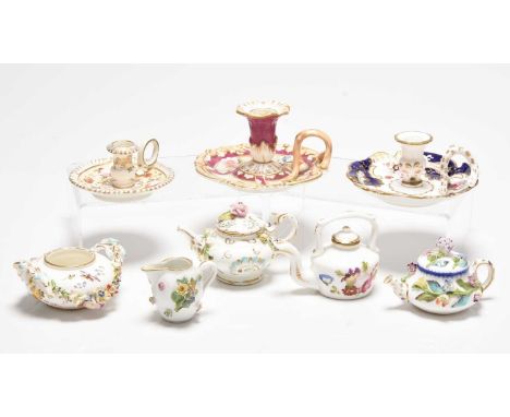 A collection of porcelain miniatures, comprising a Meissen jug, encrusted with flowers, crossed swords mark, a teapot and cov